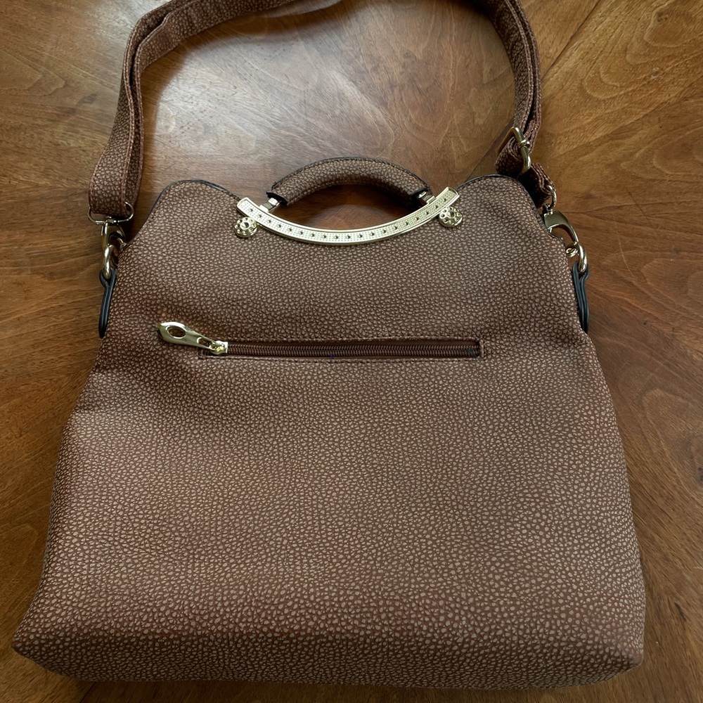 Women’s textured vinyl handbag with detachable shoulder strap and cloth lining
